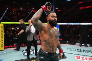 Gable Steveson celebrates after defeating Elisha Ellison at UFC 329