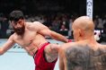Magomed Ankalaev delivers a kick to Bogdan Guskov during the UFC Abu Dhabi main event