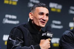 Max Holloway speaks to reporters during a UFC 326 press conference
