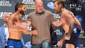 Chad Mendes and Conor McGregor face off at the UFC 189 ceremonial weigh-in