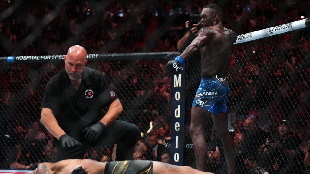 Israel Adesanya celebrates after knocking out Alex Pereira at UFC 287