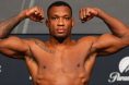 Jailton Almeida poses on the scale at an official weigh-in