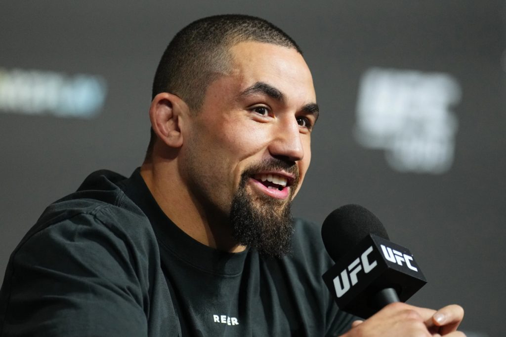 Robert Whittaker answers questions from media members before a UFC event
