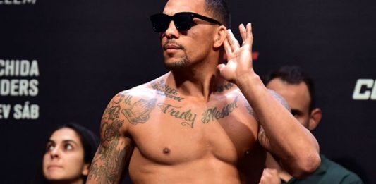 Eryk Anders putting hand to ear